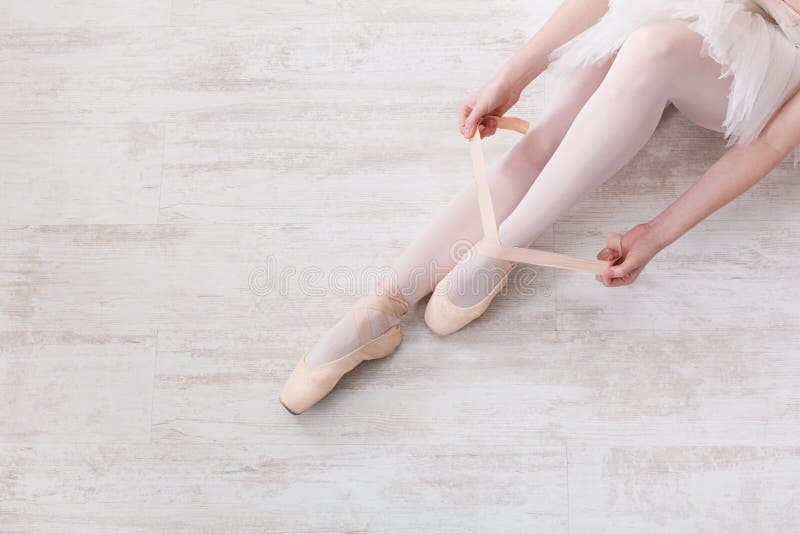 ballerina putting on shoes