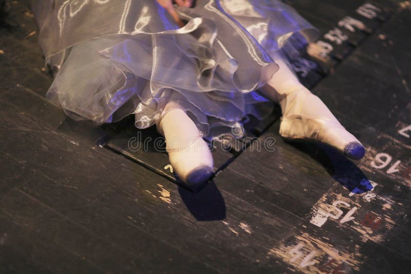 Ballerina resting sitting on the floor