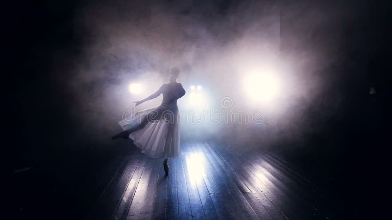 Ballerinas feet in a ballonne movement.