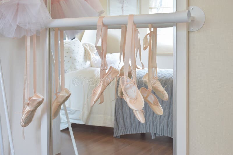 Ballet shoes hang on bar stock photo. Image of dance 83913400