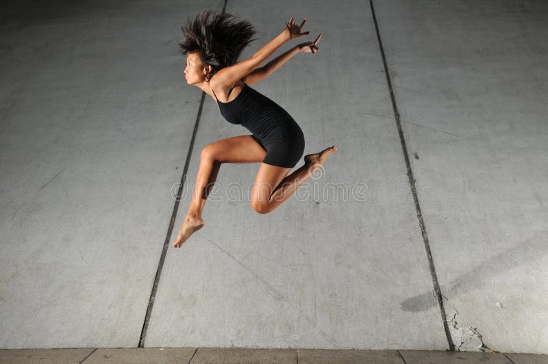 Artistic Picture of a Dancer performing athletic contemporary dance moves. Artistic Picture of a Dancer performing athletic contemporary dance moves.