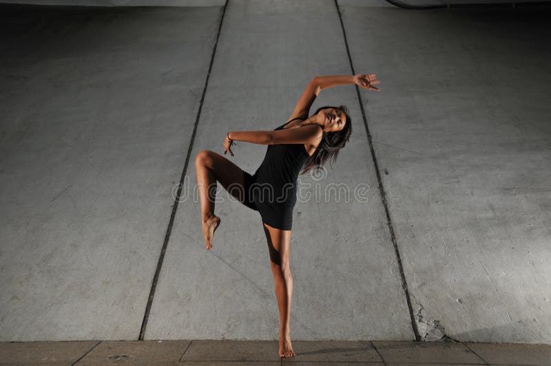 Artistic Picture of a Dancer performing athletic contemporary dance moves. Artistic Picture of a Dancer performing athletic contemporary dance moves.