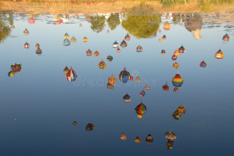 Hot air balloons reflected in a lake, Reno, Nevada. Hot air balloons reflected in a lake, Reno, Nevada