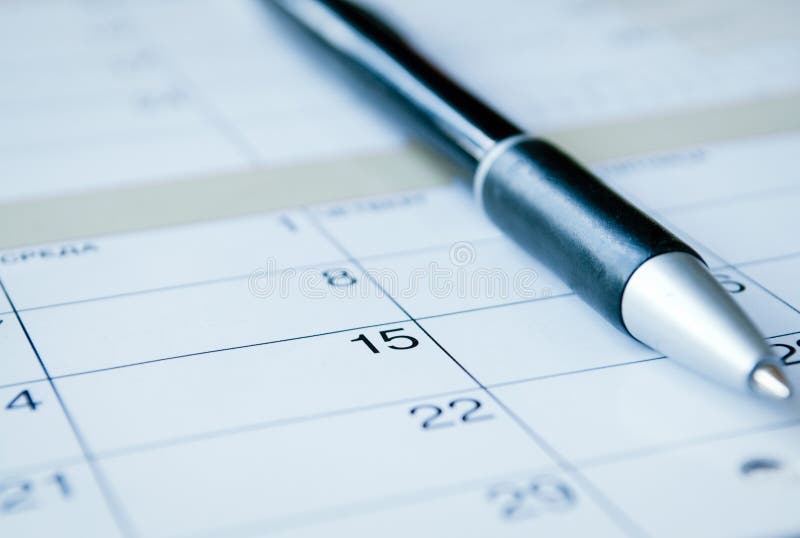 Ballpoint op een kalender stock foto's Ballpoint op een kalender stock foto's