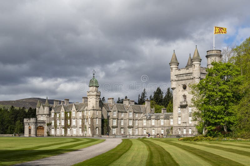 Balmoral Castle is a large estate house in Aberdeenshire, Scotland, and a residence of the British royal family. The architecture is Scottish baronial style. UK, Europe. Balmoral Castle is a large estate house in Aberdeenshire, Scotland, and a residence of the British royal family. The architecture is Scottish baronial style. UK, Europe.