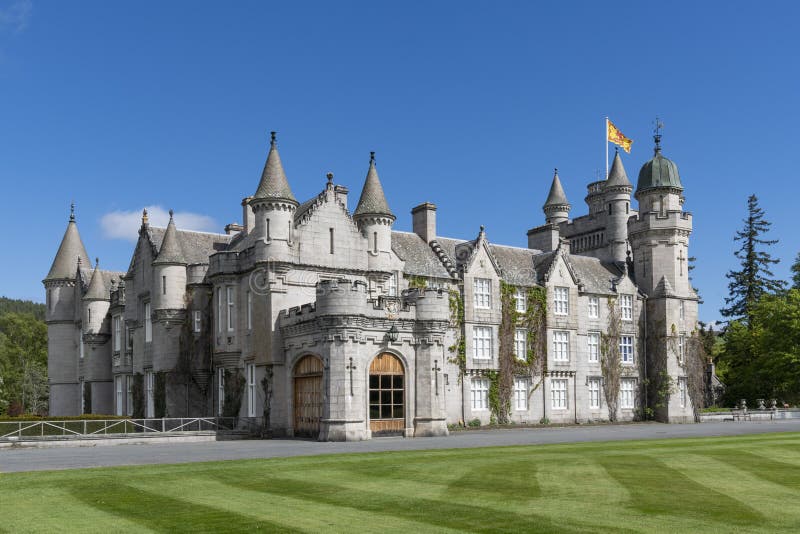 Balmoral Castle is a large estate house in Aberdeenshire, Scotland, and a residence of the British royal family. The architecture is Scottish baronial style. UK, Europe. Balmoral Castle is a large estate house in Aberdeenshire, Scotland, and a residence of the British royal family. The architecture is Scottish baronial style. UK, Europe