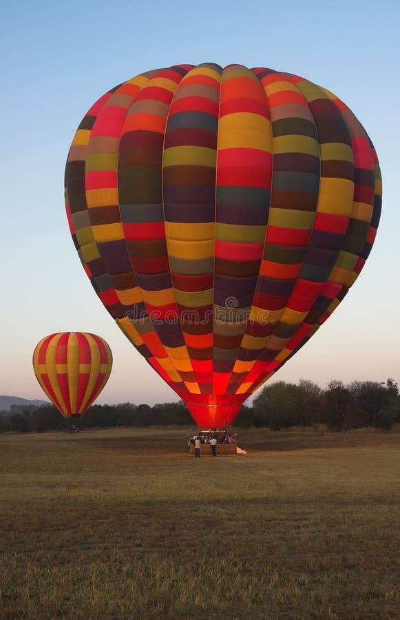 Hot air balloon burns bright gas heater before lift off. Hot air balloon burns bright gas heater before lift off