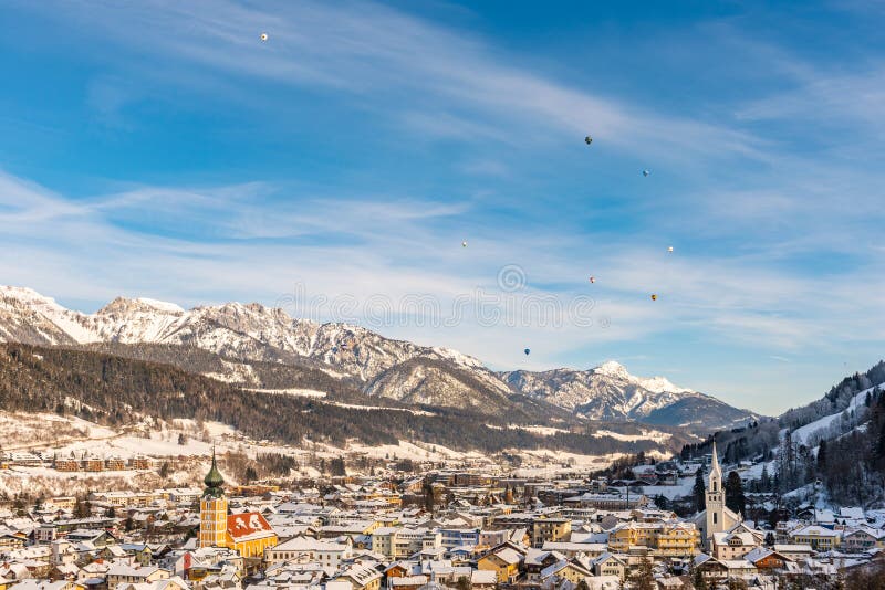 The balloons and snow-capped mountains over Schladming, Styria, Austria, Europe