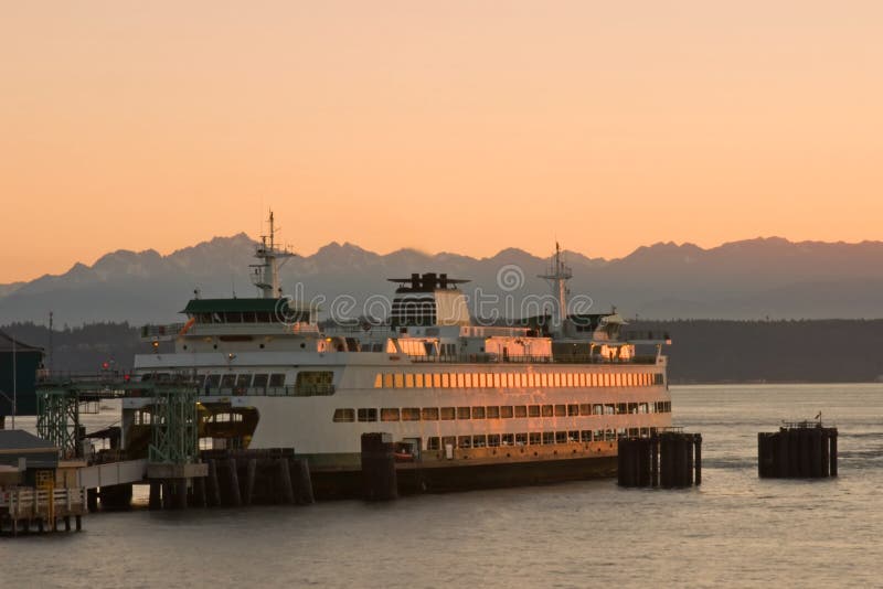 Ferry docking during sunset in the Puget Sound, Pacific Northwest, Washington State. Ferry docking during sunset in the Puget Sound, Pacific Northwest, Washington State