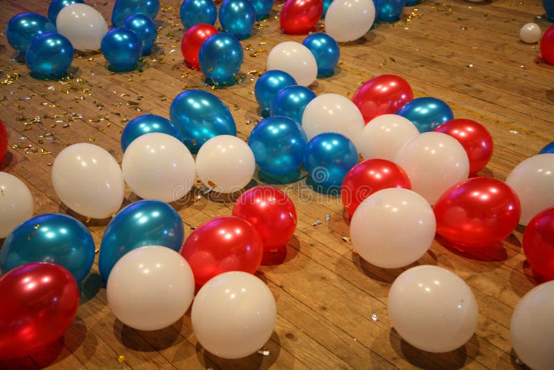 Concept, colorful balloons, text boxes on a wooden floor. Concept, colorful balloons, text boxes on a wooden floor.