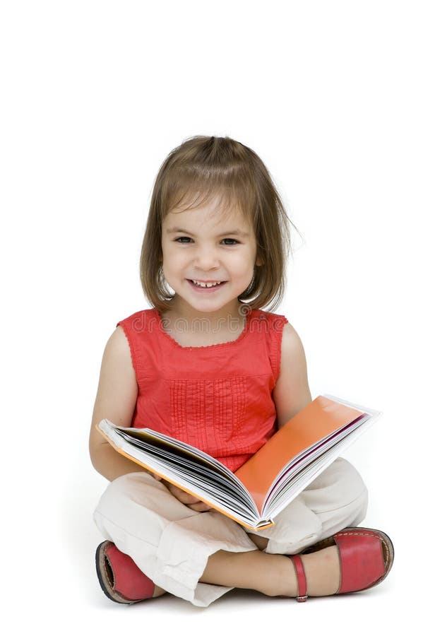 Little girl reading a book isolated on white. Little girl reading a book isolated on white