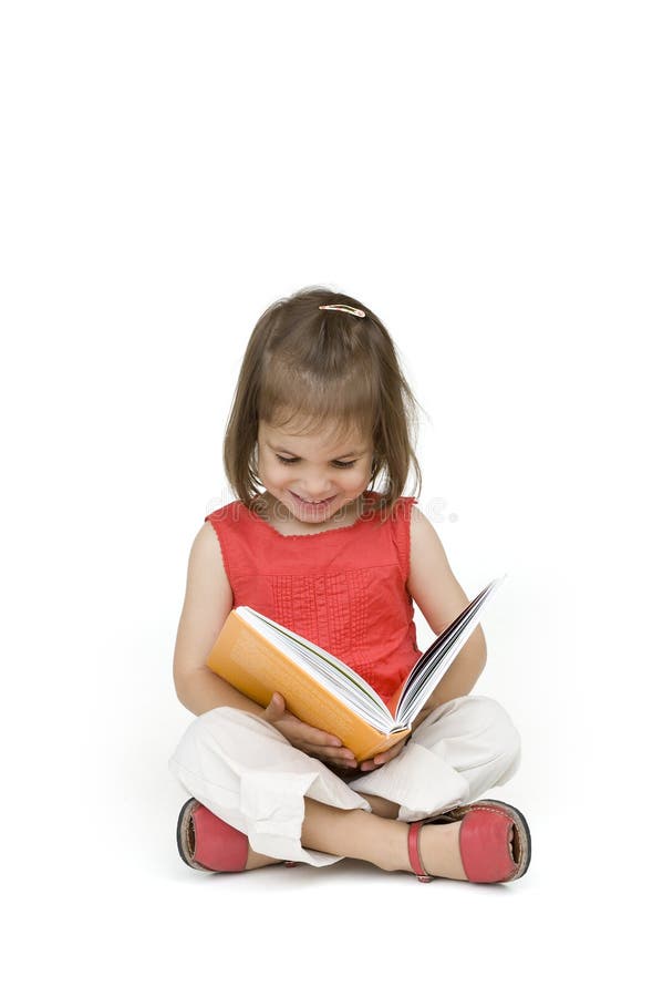 Little girl reading a book isolated on white. Little girl reading a book isolated on white