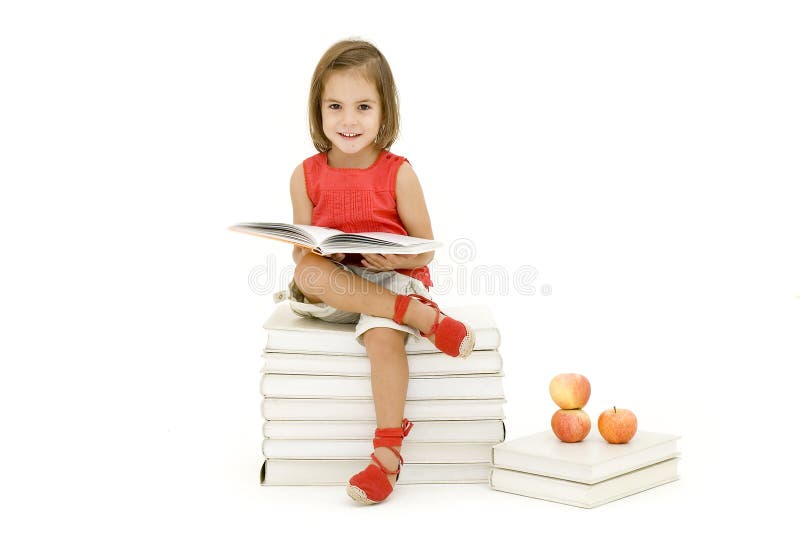 Little girl reading a book isolated on white. Little girl reading a book isolated on white