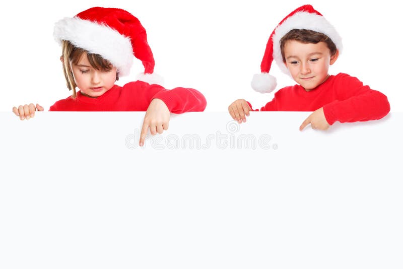Bambini Santa Claus dei bambini di Natale che indica il copysp vuoto dell'insegna fotografia stock libera da diritti Bambini Santa Claus dei bambini di Natale che indica il copysp vuoto dell'insegna fotografia stock libera da diritti