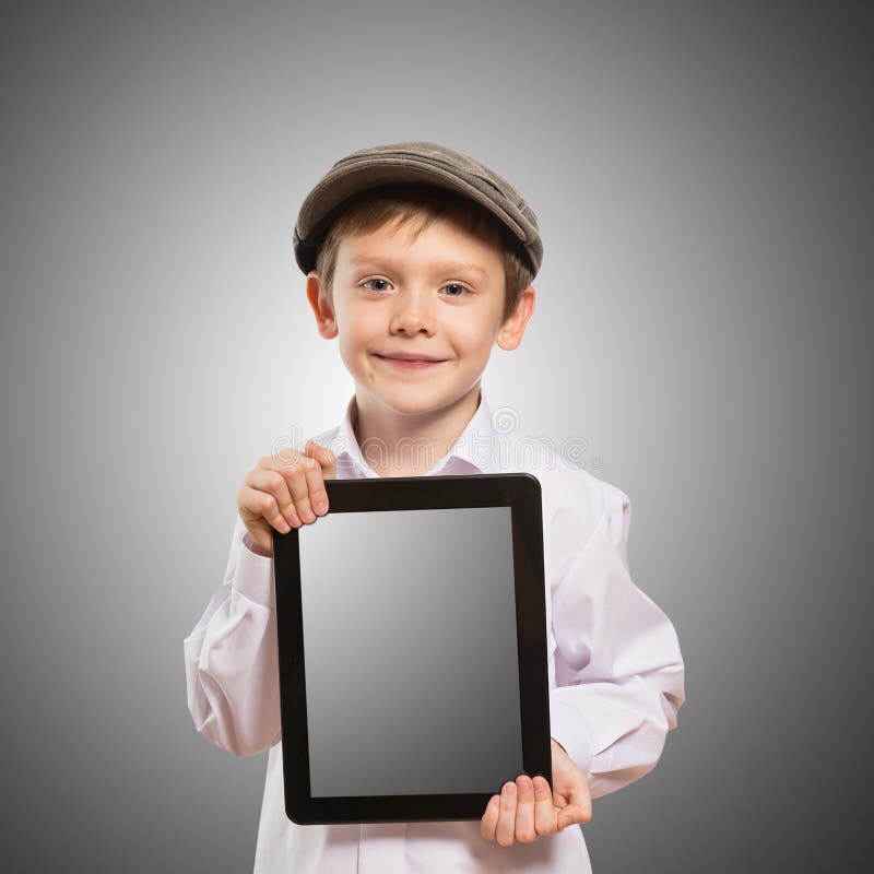 Bambino che per mezzo di un PC della compressa fotografie stock libere da diritti Bambino che per mezzo di un PC della compressa fotografie stock libere da diritti