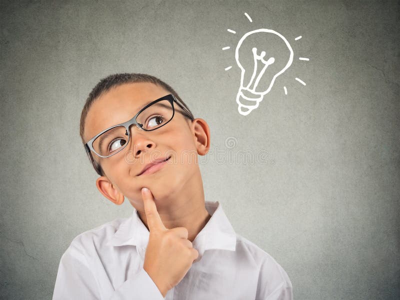 Closeup thinking child looking up with lightbulb above head. Closeup thinking child looking up with lightbulb above head