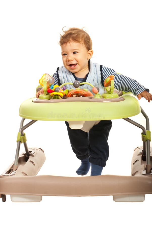 Bambino felice in camminatore fotografia stock libera da diritti Bambino felice in camminatore fotografia stock libera da diritti