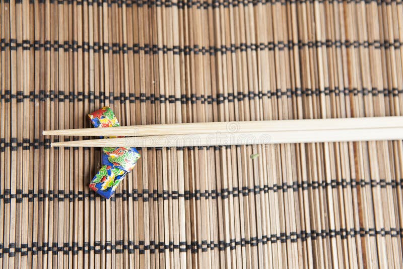 Bamboo Chopsticks on a Handmade Origami Chopstick Holder Stock Photo