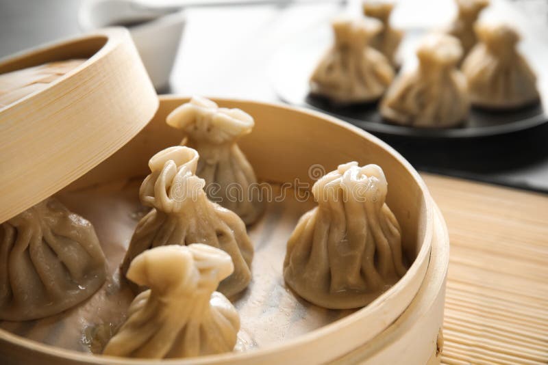 Bamboo Steamer with Tasty Baozi Dumplings on Table Stock Image Image of closeup, dish 143178811