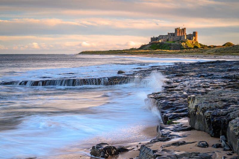 Bamburgh beach and dunes are dominated by the imposing medieval castle and located within Northumberland Coast Area of Outstanding Natural Beauty. Bamburgh beach and dunes are dominated by the imposing medieval castle and located within Northumberland Coast Area of Outstanding Natural Beauty