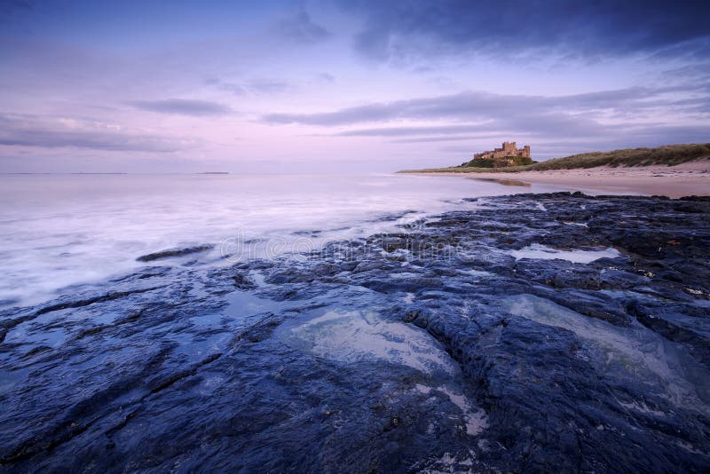 This is Bamburgh Castle in Northumberland, England. The Farne Islands are visible on the horizon. This is Bamburgh Castle in Northumberland, England. The Farne Islands are visible on the horizon.