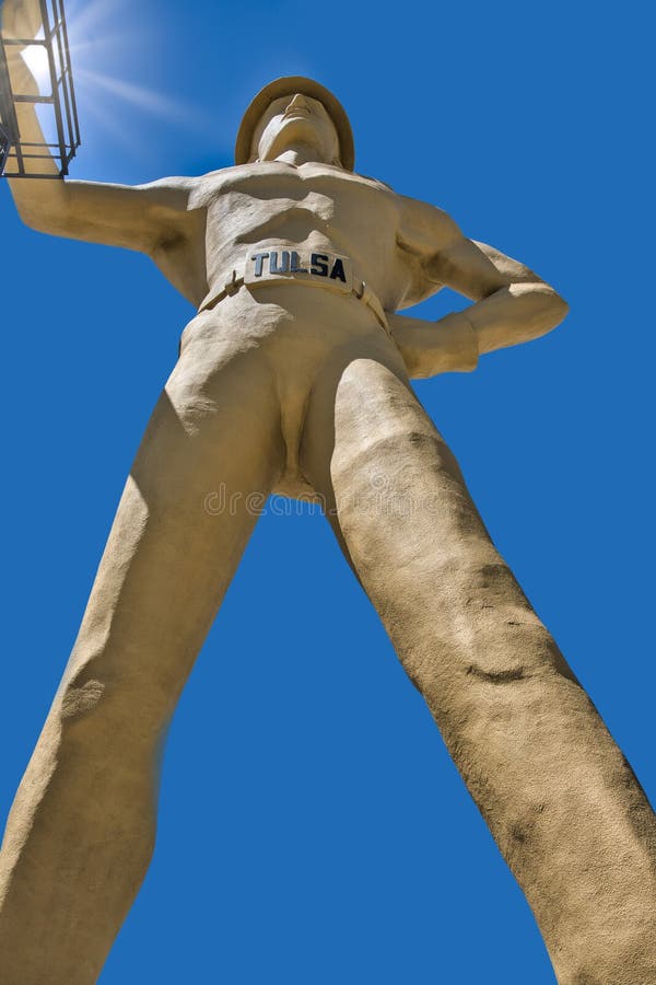 `A version of the Golden Driller was originally built in 1952 by the Mid-Continent Supply Company of Fort Worth as a temporary feature of the International Petroleum Exposition. Six years later, one was erected again for the 1959 show. Due to the positive attention it attracted, the company donated the statue to the Tulsa County Fairgrounds Trust Authority which had it anatomically redesigned [3] and permanently installed in front of the Tulsa Expo Center for the 1966 International Petroleum Exposition. The statue`s right hand rests on an oil derrick which had been moved from a depleted oil field in Seminole, Oklahoma.
An inscription at the base of the statue reads: `The Golden Driller, a symbol of the International Petroleum Exposition. Dedicated to the men of the petroleum industry who by their vision and daring have created from God`s abundance a better life for mankind.`. `A version of the Golden Driller was originally built in 1952 by the Mid-Continent Supply Company of Fort Worth as a temporary feature of the International Petroleum Exposition. Six years later, one was erected again for the 1959 show. Due to the positive attention it attracted, the company donated the statue to the Tulsa County Fairgrounds Trust Authority which had it anatomically redesigned [3] and permanently installed in front of the Tulsa Expo Center for the 1966 International Petroleum Exposition. The statue`s right hand rests on an oil derrick which had been moved from a depleted oil field in Seminole, Oklahoma.
An inscription at the base of the statue reads: `The Golden Driller, a symbol of the International Petroleum Exposition. Dedicated to the men of the petroleum industry who by their vision and daring have created from God`s abundance a better life for mankind.`