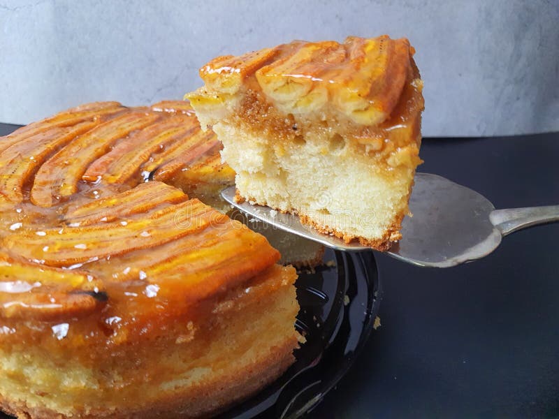 Banana and Cinnamon Cake with a Slice on a Spatula. Stock Image Image