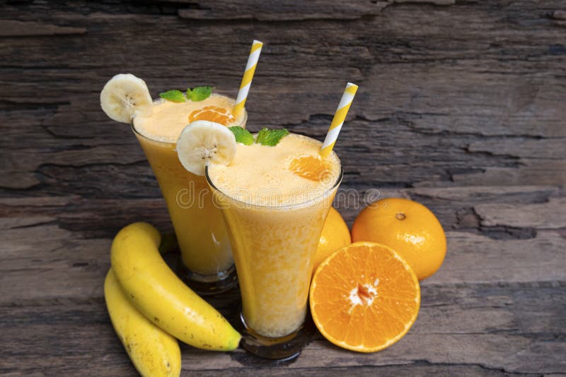 Banana mix orange smoothies yellow colorful fruit juice milkshake blend beverage healthy.