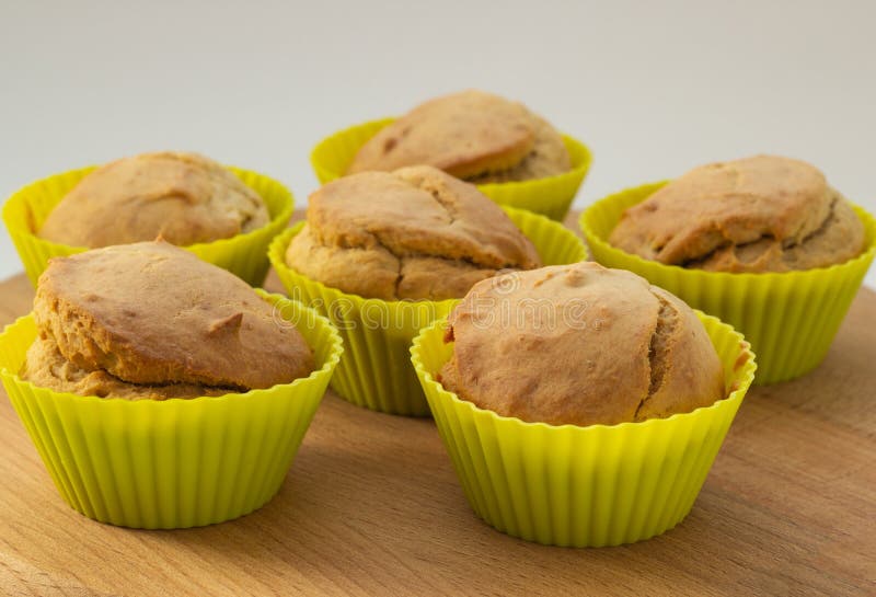 Banana muffins on a wooden board, natural light, close-up stock photography Banana muffins on a wooden board, natural light, close-up stock photography