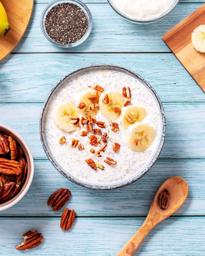 Banana and Pecan Nuts Overnight Oatmeal with Chia Seeds in Bowl, Rich