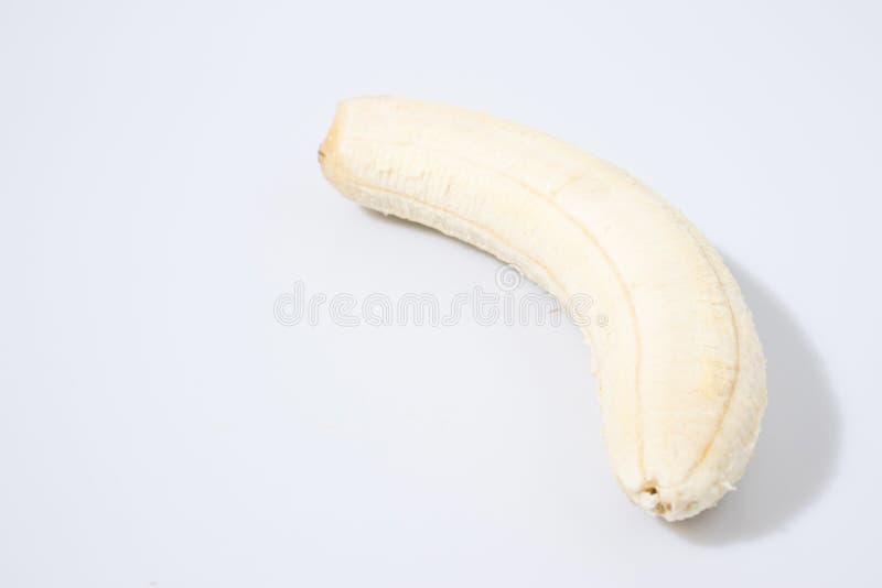 Banana without peel in a white background composition.