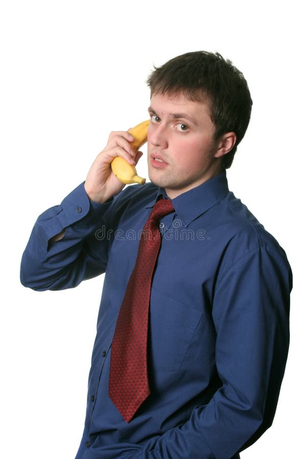 Businessman having a conversation via the banana phone. Businessman having a conversation via the banana phone