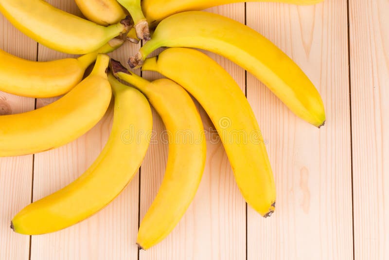 Banana round shape as flower on wood.