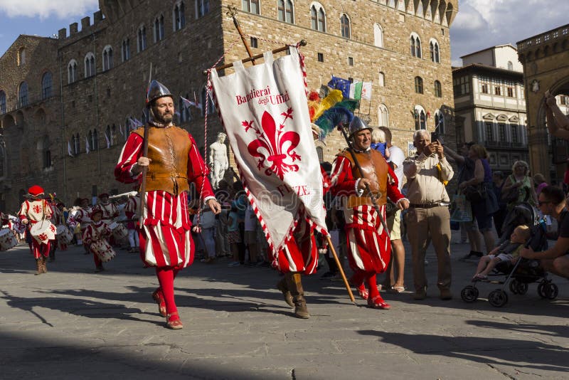 Flagbearers In Medieval Costume At Traditional Parade Of Epiphany