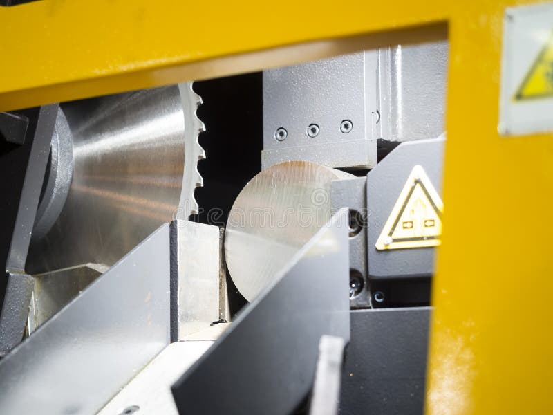 Band saw cutting steel bar stock photo. Image of process 63267092
