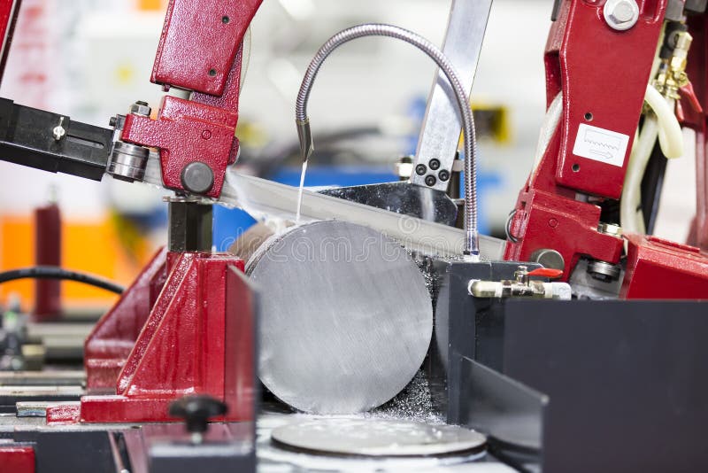 Band saw cutting steel bar stock image. Image of manufacture 56073833
