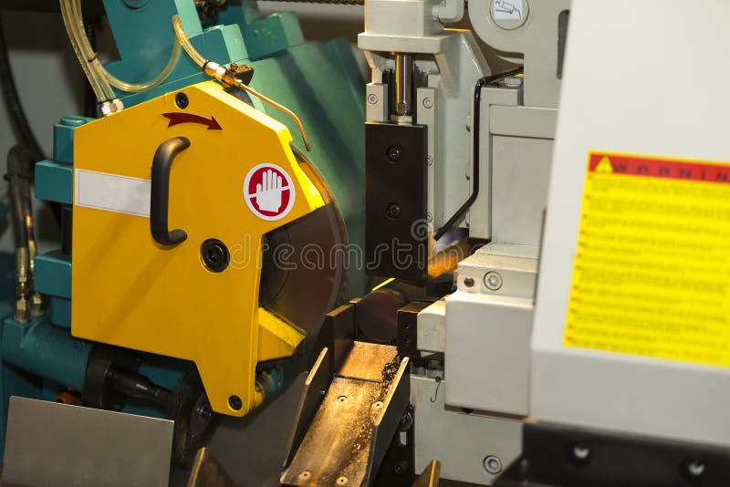 Band saw cutting steel bar stock image. Image of bandsaw 62960547