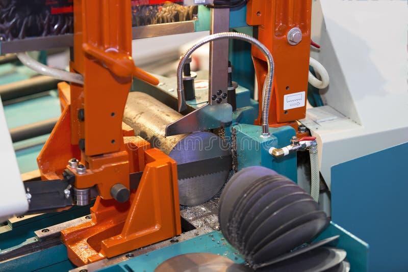 Band saw cutting steel bar stock image. Image of machinery 62960745