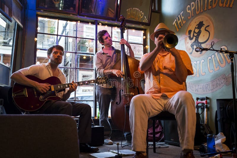 New Orleans, Louisiana - June 20, 2014: Jazz band playing at the Spotted Cat Music Club in the city of New Orleans, Louisiana, USA. New Orleans, Louisiana - June 20, 2014: Jazz band playing at the Spotted Cat Music Club in the city of New Orleans, Louisiana, USA