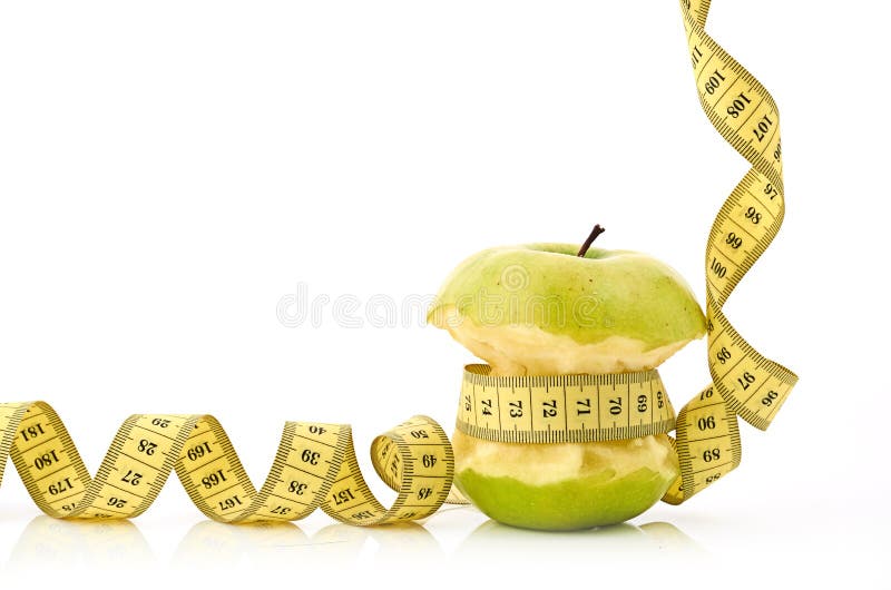 Bande et pomme de mesure photographie stock libre de droits Bande et pomme de mesure photographie stock libre de droits