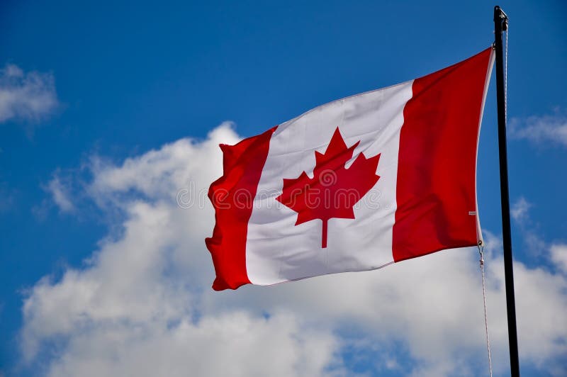 Flag of Canada in the blue sky. Flag of Canada in the blue sky