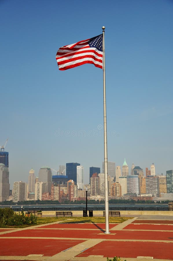 National Flag of United States, with Manhattan skyline in the background, Liberty State Park, New Jersey, USA. National Flag of United States, with Manhattan skyline in the background, Liberty State Park, New Jersey, USA
