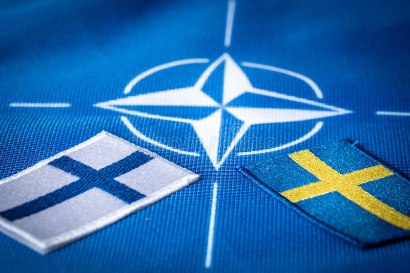 Flags of Sweden and Finland against the background of the NATO symbol, The concept of the Scandinavian countries joining the North Atlantic alliance, 9 may 2022. Flags of Sweden and Finland against the background of the NATO symbol, The concept of the Scandinavian countries joining the North Atlantic alliance, 9 may 2022
