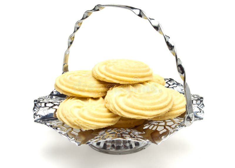 Viennese Swirl Biscuits on fancy chrome platter isolated on white. Viennese Swirl Biscuits on fancy chrome platter isolated on white.