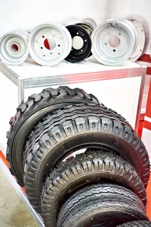 Wheelbarrow tires and stamped discs in car store. Wheelbarrow tires and stamped discs in car store