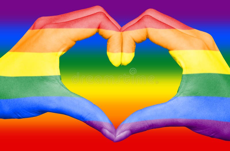 bandera-gay-del-arco-iris-pintada-en-las-manos-que-forman-un-corazón-el-fondo-concepto-amor-