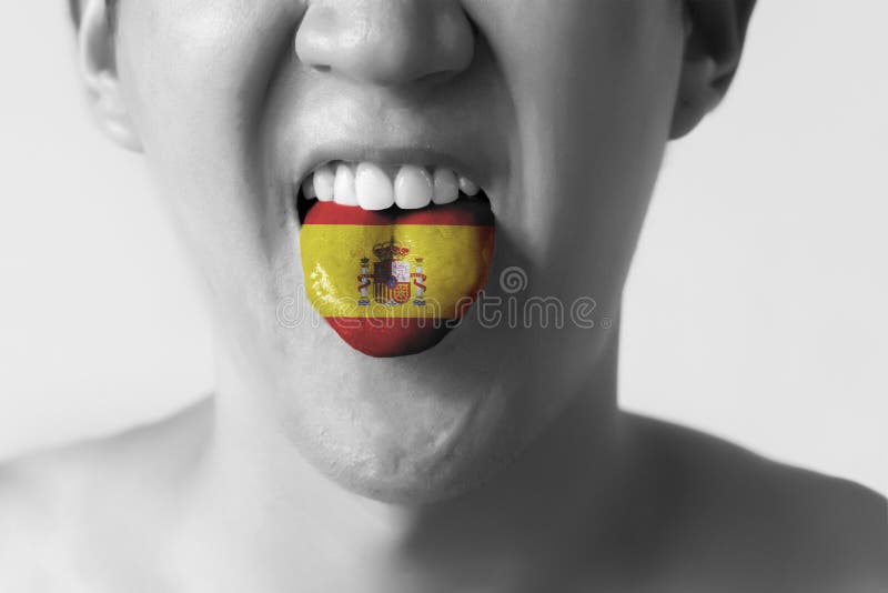 Il Segno Sulla N Spagnola Bandiera Della Spagna Dipinta in Lingua Di Un Uomo - Indicando Lingua