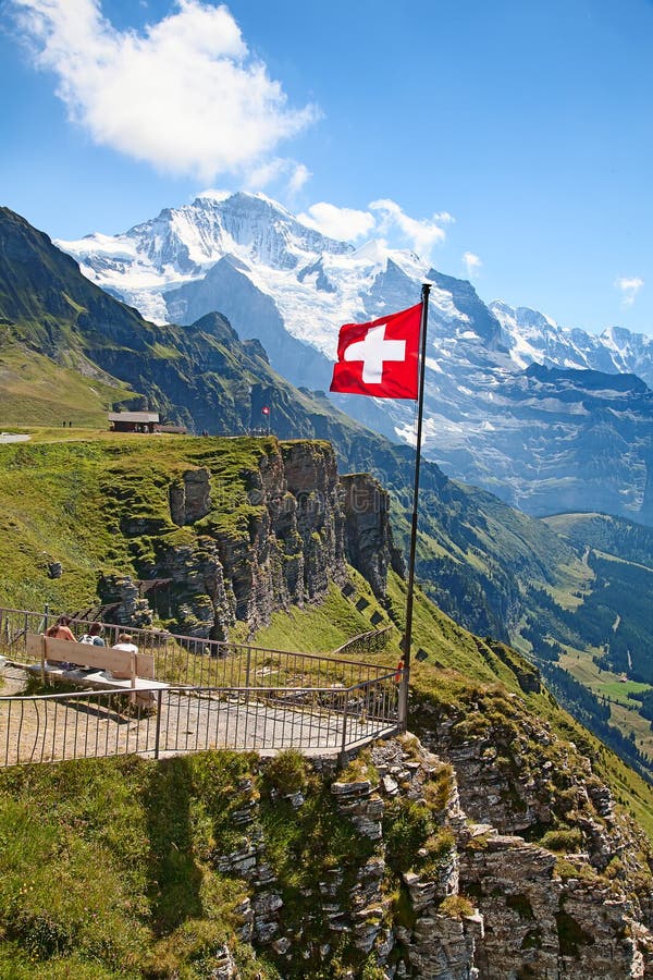 Swiss flag on the top of Mannlichen (Jungfrau region, Bern, Switzerland). Swiss flag on the top of Mannlichen (Jungfrau region, Bern, Switzerland)