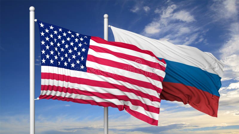 Bandiere d'ondeggiamento di U.S.A. e della Russia sull'asta della bandiera