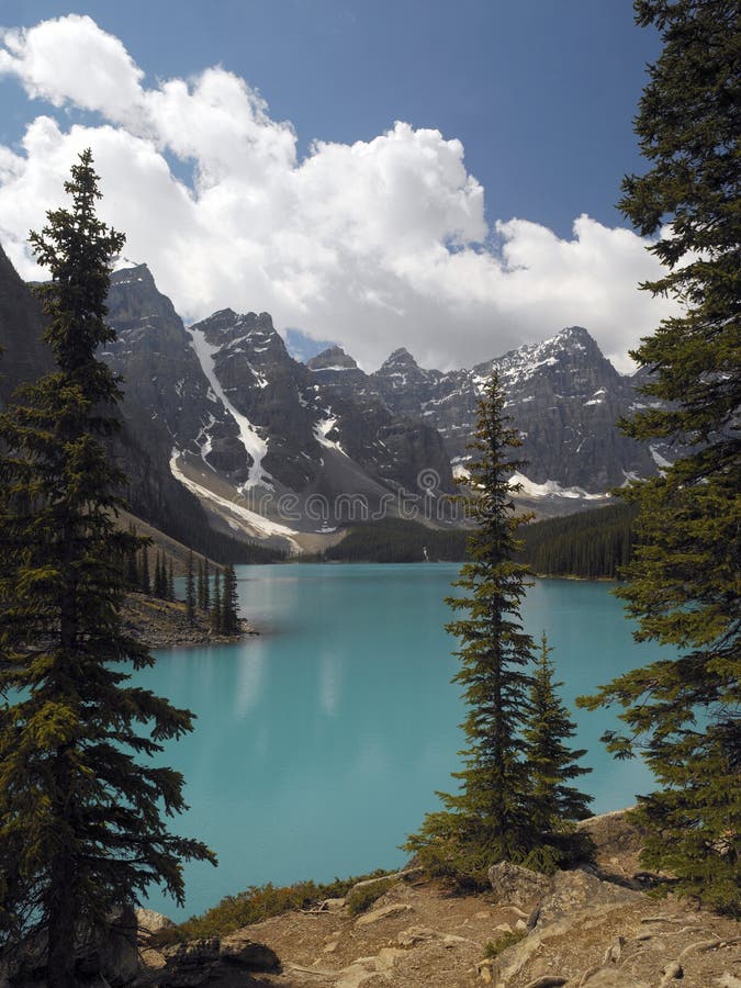 Moraine Lake is a glacially-fed lake in Banff National Park, near Lake Louise in Alberta, Canada. It is situated in the Valley of the Ten Peaks. The color is due to the refraction of light off the rock flour deposited in the lake on a continual basis by glacial meltwater. Moraine Lake is a glacially-fed lake in Banff National Park, near Lake Louise in Alberta, Canada. It is situated in the Valley of the Ten Peaks. The color is due to the refraction of light off the rock flour deposited in the lake on a continual basis by glacial meltwater.